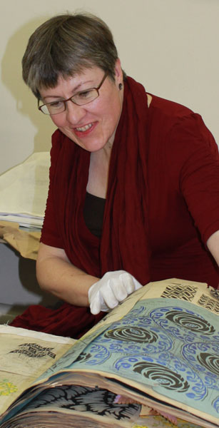 Artist Helen Parrott examining our collections 