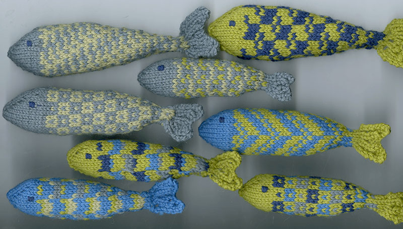 Knitted fish installation by Helen Farrar inspired by Bradford College Textile Archive